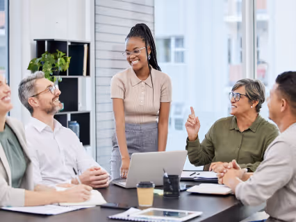 A team talking around a meeting table